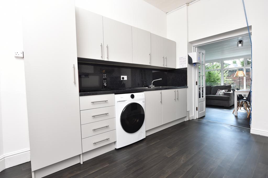 Another view of the clean and modern kitchen.